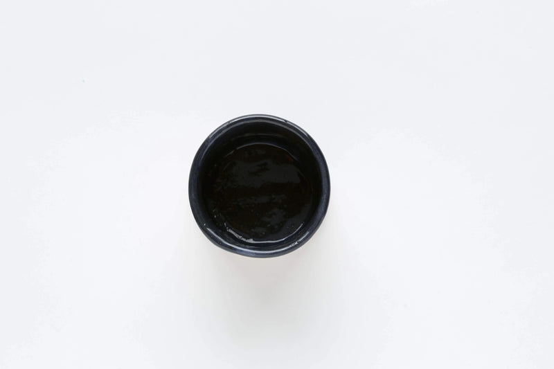 Handmade black ceramic cup inside view