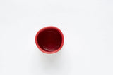 Handmade red ceramic cup inside view