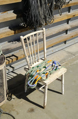 Our Corme leashes placed on a chair at the sun in Corme port