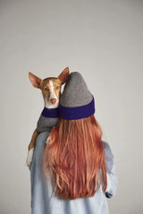 Woman wearing our Wool and Cashmere Grey Beanie and a dog in her arms